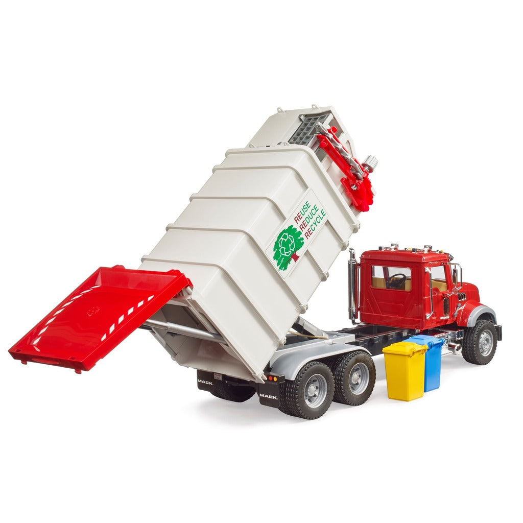 Red Bruder Mack garbage truck toy with white side-loading container and small yellow and blue recycling bins