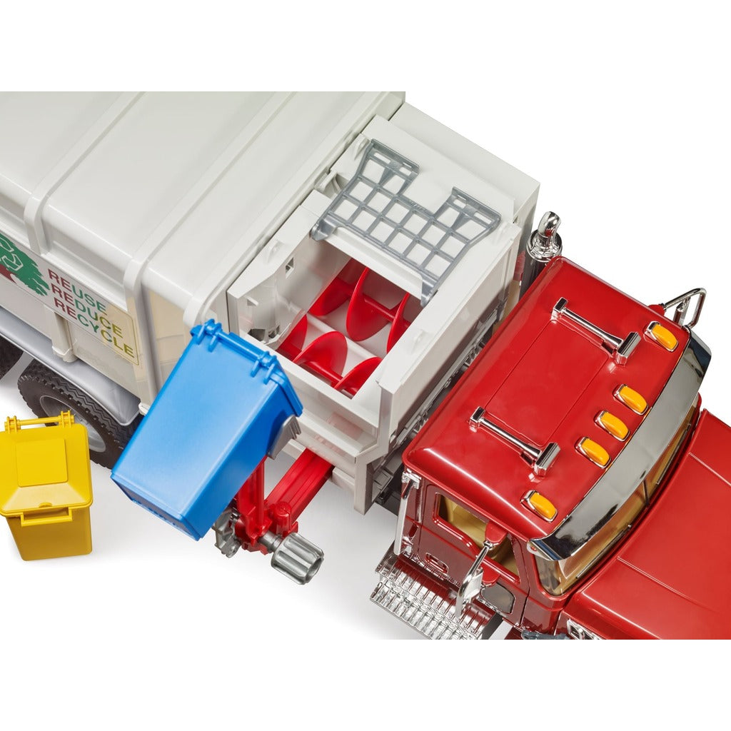 Red Bruder Mack Granite garbage truck with side-loading mechanism lifting blue recycling bin